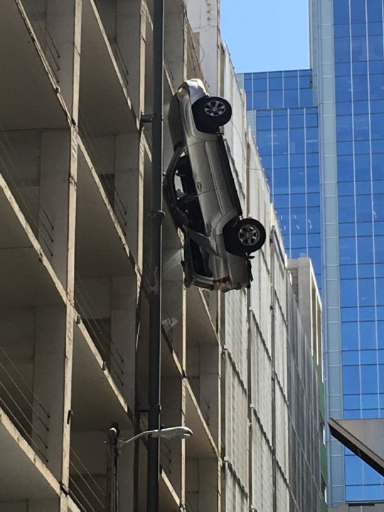 car dangling Austin parking garage KXAN