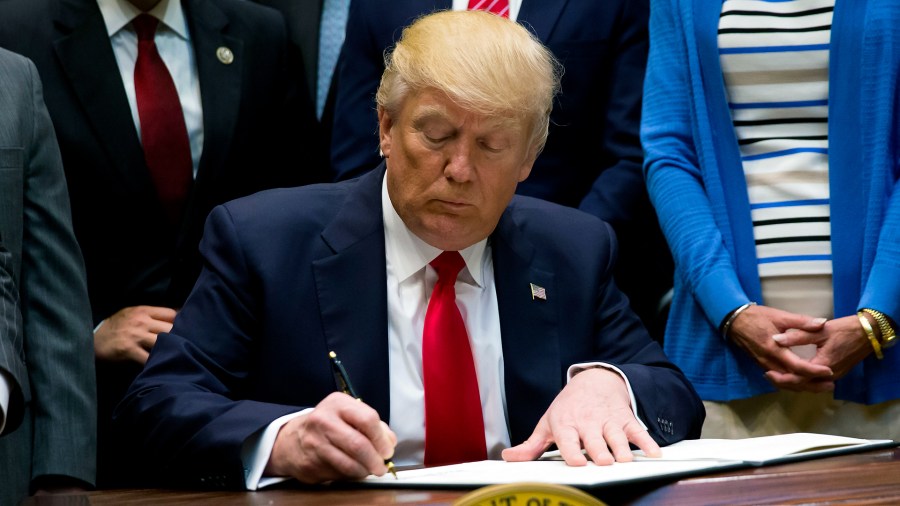 President Trump signing an executive order-159532.jpg84960344