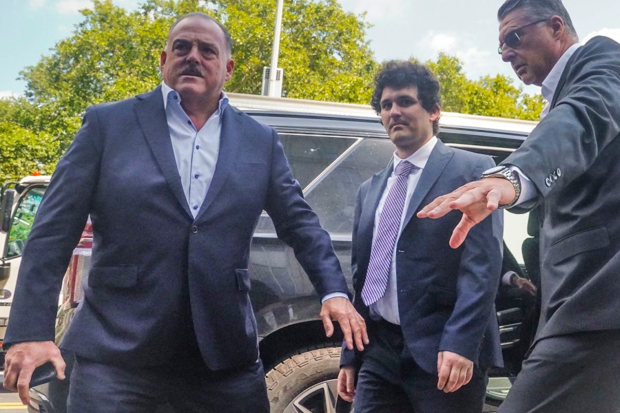 FILE - FTX founder Sam Bankman-Fried arrives at Manhattan federal court, Friday, Aug. 11, 2023, in New York. A lawyer for Bankman-Fried said Wednesday, Oct. 25, 2023, the FTX founder plans to testify at his fraud trial. (AP Photo/Bebeto Matthews, File)