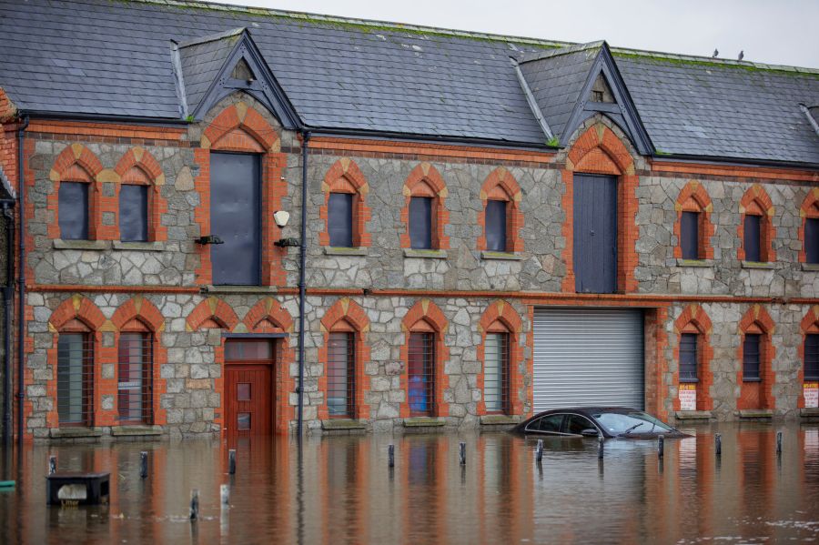 A car submerged in flood water at Basin Walk Car Park in Newry Town, Co Down, Tuesday Oct. 31, 2023. Flooding was reported in parts of Northern Ireland, with police cautioning people against travelling due to an amber rain warning. (Liam McBurney/PA via AP)