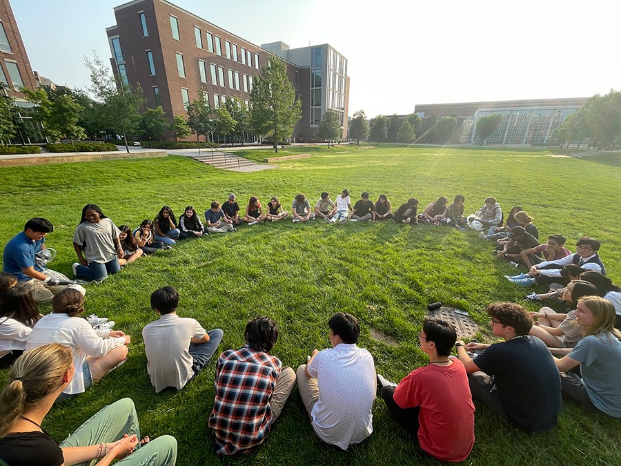 Participants in the Summer Science Program sit in a circle at Purdue University in West Lafayette, Ind., on July 21, 2023. SSP has puzzled over what do to with a surprise bequest of an estimated $200 million — about 100 times its annual budget. (Christin Latus, Summer Science Program via AP Photo)