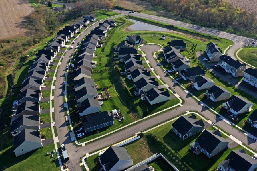 File - Homes in Middlesex Township, Pa., are shown on Apr. 19, 2023. A case in federal court in Missouri ended Tuesday with a jury ordering the National Association of Realtors and some of the nation's biggest real estate brokerages to pay almost $1.8 billion in damages after finding that they artificially inflated commissions paid to real estate agents. (AP Photo/Gene J. Puskar, File)