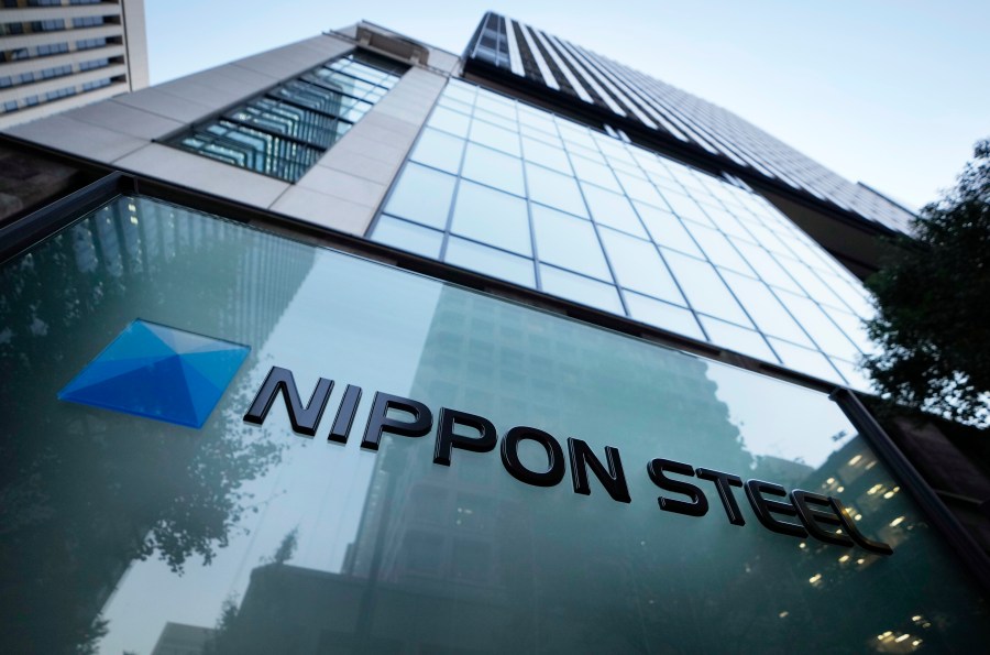 FILE - Nippon Steel Corporation's logo is displayed on a sign outside its headquarters in Tokyo on Nov. 26, 2021. Nippon Steel Corp. has dropped its lawsuit against Toyota Motor Corp. over a patent for a technology used in electric motors, saying wrangling among Japanese companies was not beneficial to keep the nation competitive, according to Japan’s top steelmaker's statement Thursday, Nov. 2, 2023. (AP Photo/Hiro Komae, File)