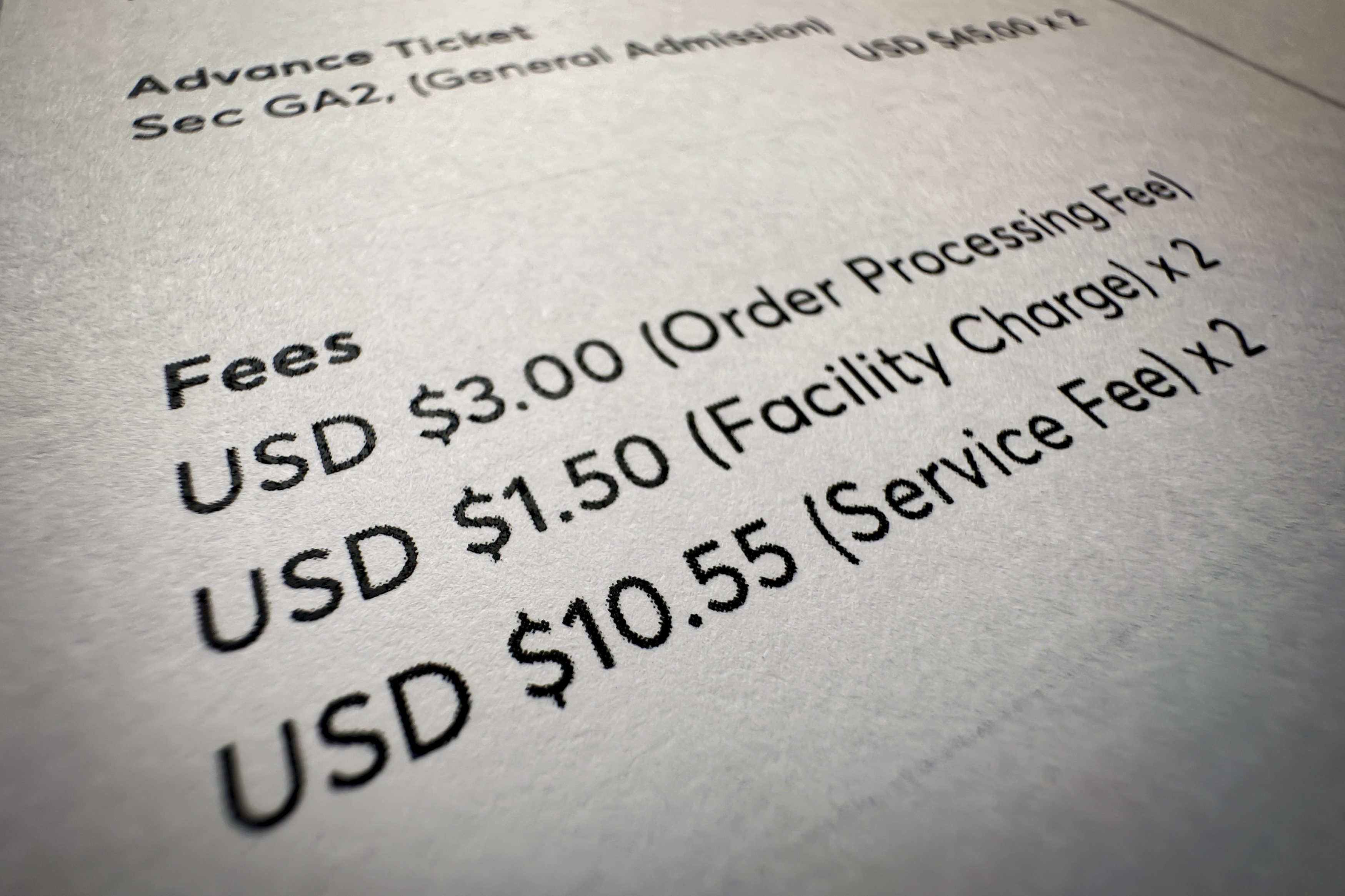 Fees on a concert ticket receipt are shown in this photo taken Wednesday, Nov. 1, 2023, in New York. "Junk fees" are just what they sound like: hidden or misleading charges that increase the total cost of concert tickets, hotel rooms, utility bills and other goods and services. (AP Photo/John Minchillo)