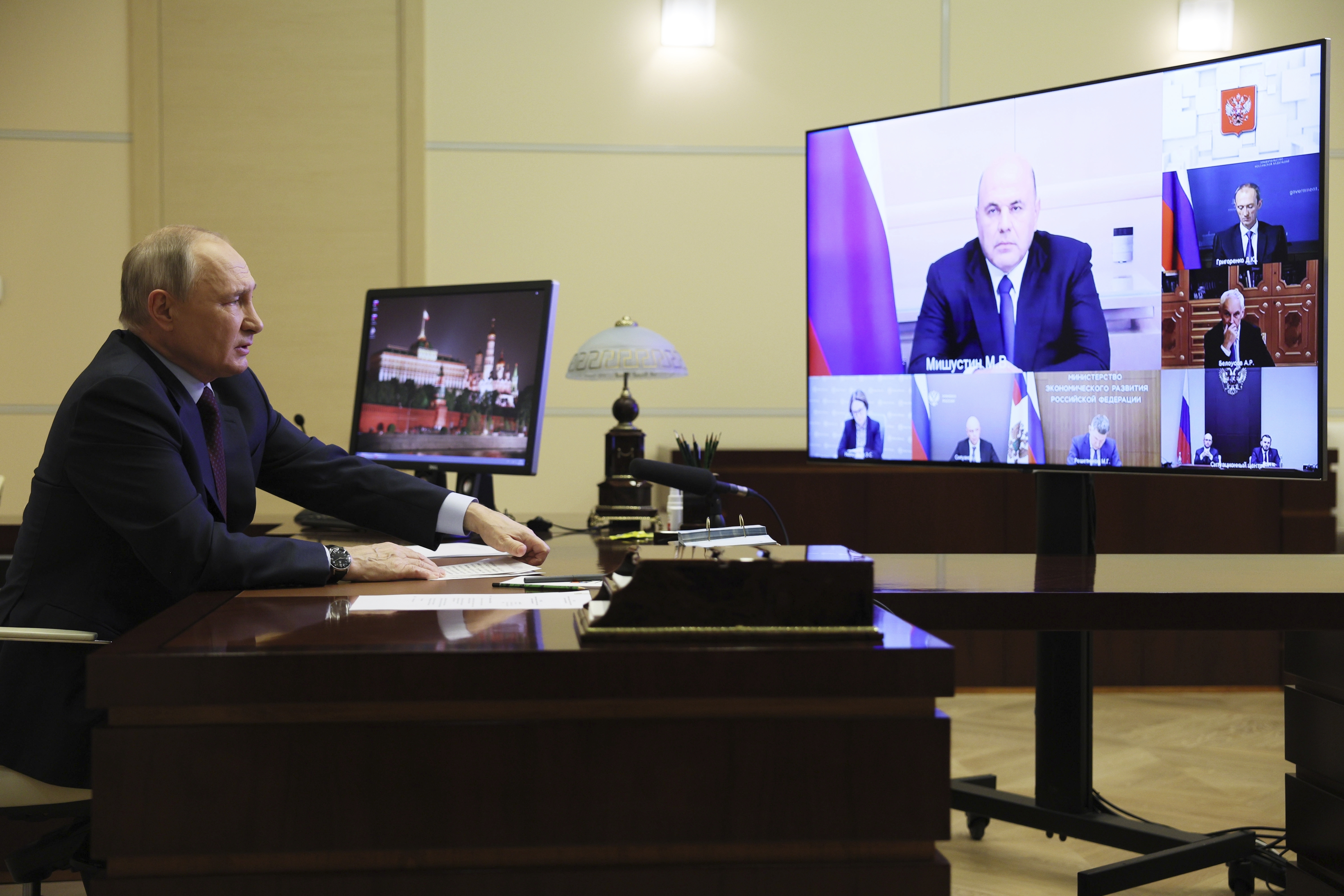 Russian President Vladimir Putin chairs a meeting on economic issues via videoconference at the Novo-Ogaryovo state residence outside Moscow, Russia, Wednesday, Nov. 1, 2023. Russian Prime Minister Mikhail Mishustin is seen on the screen. (Gavriil Grigorov, Sputnik, Kremlin Pool Photo via AP)